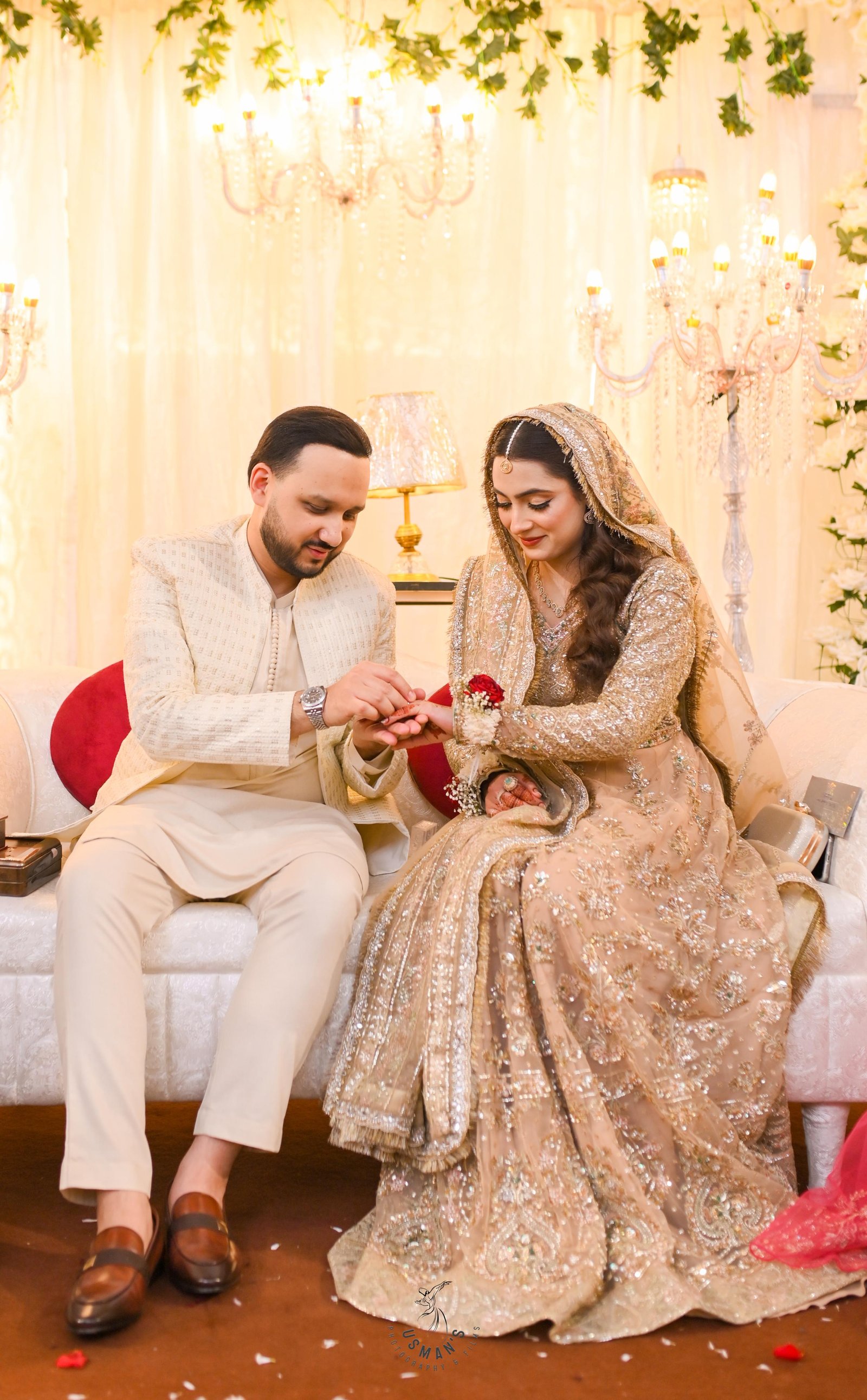 Ayesha and her husband exchanging a ring