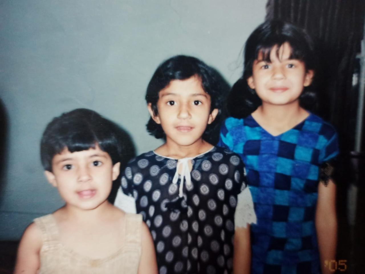 A childhood group photograph of three children
