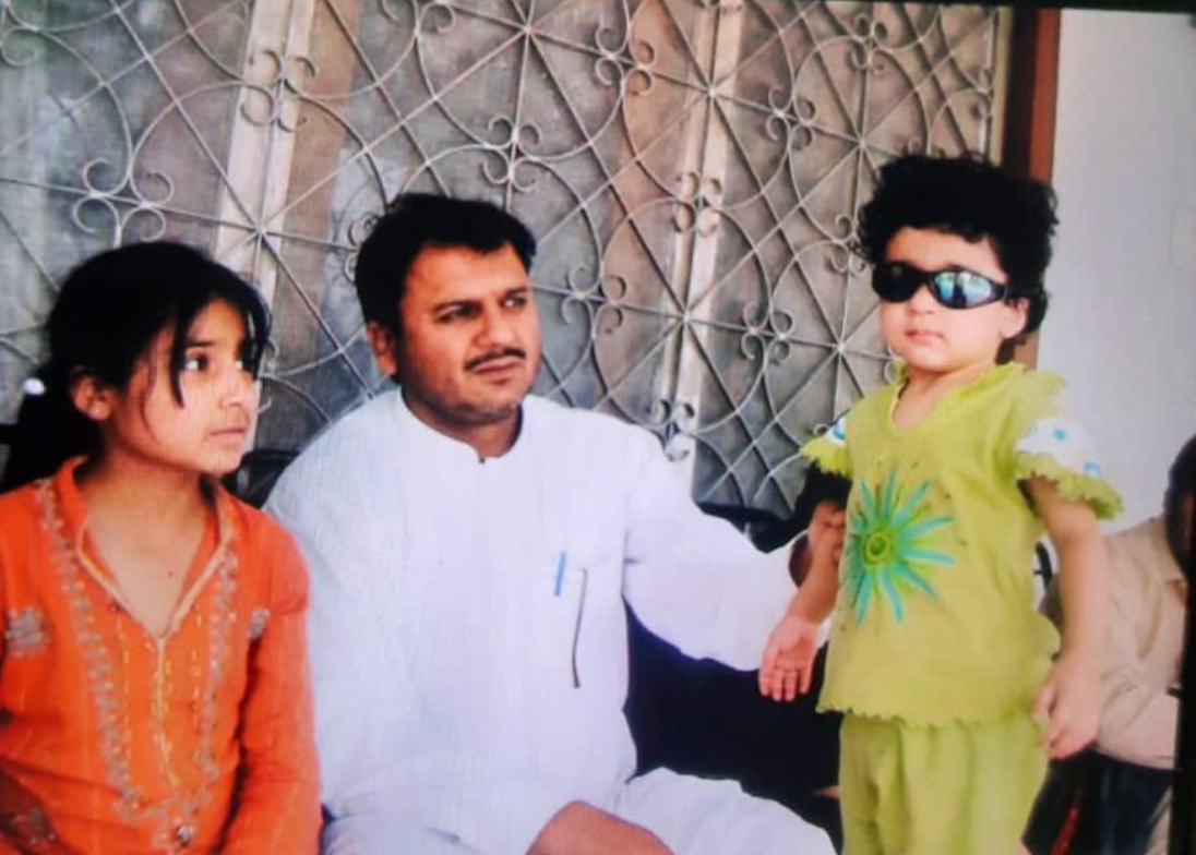 A family photograph with a child wearing sunglasses